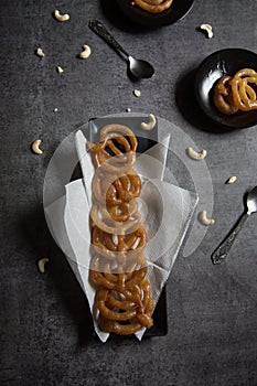 Popular Indian sweet jalebi or imarati made by deep frying in pure ghee served in a tray.