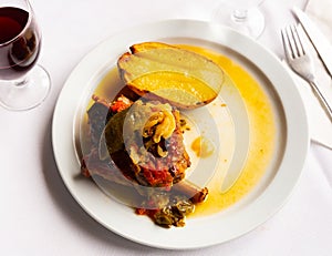 Popular Italian dish Ternasco Al Forn, prepared with delicious young lamb meat photo