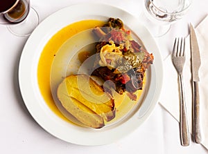 Popular Italian dish Ternasco Al Forn, prepared with delicious young lamb meat photo