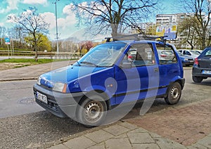 Dark blue old Polish car Fiat Cinquecento private car parked