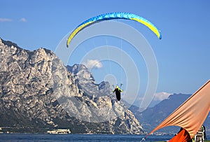 popular paragliding above a lake, Lago di Garda, Italy