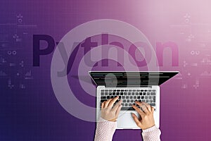 The popular Python programming language with a person behind a laptop photo