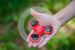 Popular red plastic finger spinner photo