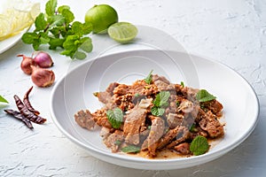 Popular Thai food.Spicy Grilled Pork Salad,grill pork with Charcoal and sliced mixed with lime juice,fish sauce,sugar and chilli