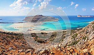 Popular touristic resort, coast of island Crete, Greece. Marvelous landscape of a rocky hill, Balos beach with fantastic sand.