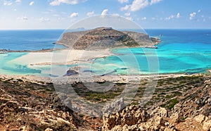 Popular touristic resort, coast of island Crete, Greece. Marvelous landscape of a rocky hill, Balos beach with fantastic sand.