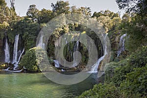 Popular with tourists Kravica waterfall is a large tufa cascade on the TrebiÅ¾at River, in the karstic heartland of Herzegovina in