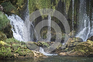 Popular with tourists Kravica waterfall is a large tufa cascade on the TrebiÅ¾at River, in the karstic heartland of Herzegovina in