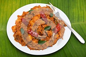 Popular traditional South Indian Kerala food Kappa or tapioca biryani hot and spicy dish photo