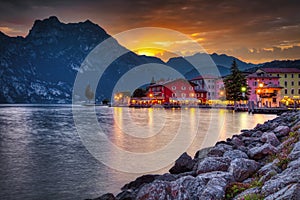 Popular travel destination, the Torbole promenade on Lake Garda at dusk,