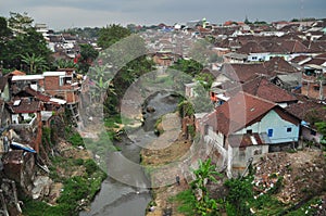 population density, many housing estates stand on the banks of rivers in Java.