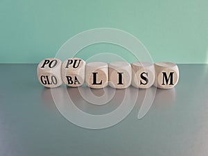 Populism or globalism. Turned cubes and changes word \'globalism\' to \'populism\'. photo