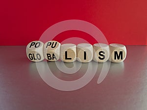 Populism or globalism. Turned cubes and changes word \'globalism\' to \'populism\'. photo