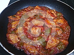 Porc loin with green pepper and tomato sauce