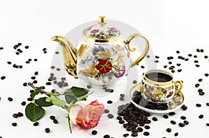 Porcelain coffee set (cup and jug) with rose flower and coffee beans