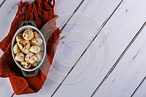 porcelain container with balls of seasoned buffalo mozzarella