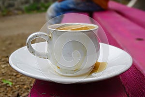 Porcelain cup of tea with milk isolated.