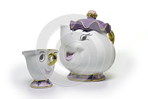 Porcelain cup and teapot isolated