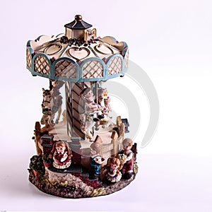 Porcelain dolls riding on a carousel photo