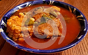 Mole de olla, typical Mexican soup with corncob, pork and chile