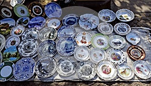 Porcelain plates with beautiful pictures at the flea market