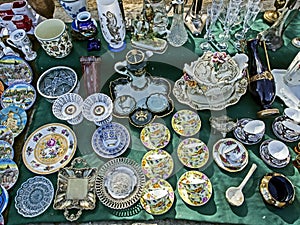 Porcelain plates with beautiful pictures at the flea market