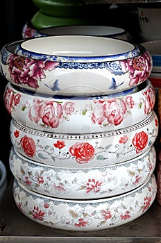 Porcelain pots in rows photo