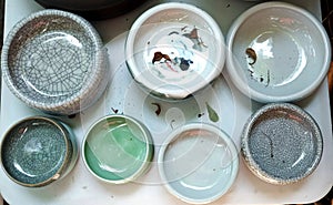 Porcelain pots in rows photo