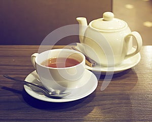 Porcelain teapot, teacup, spoon and canella