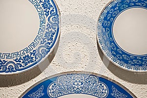 Porcelain white and blue chinaware on wall