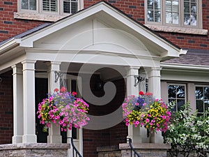 Porch with hanging baskets of flowers