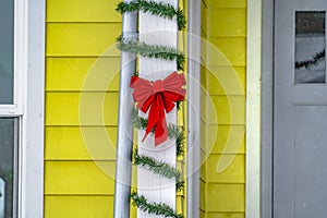 Porch pillar with holiday decorations in Daybreak