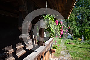 Porch of traditional Maramures wooden church. UNESCO world heritage site. Surdesti, Maramures, Romania