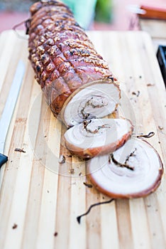 Porchetta on a wooden cutting board