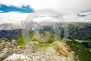 Pordoi pass mountain road and Marmolada mountain range rom the Sass Pordoi plateau in Dolomites, Italy, Europe