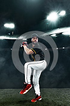 Porfessional baseball player with ball on grand arena. Ballplayer on stadium in action.