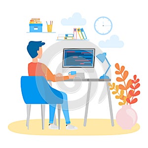 Porgrammer sitting at desk and working on laptop computer