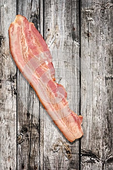 Pork Bacon Rasher Set On Old Weathered Cracked Wooden Garden Table