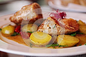 Pork with baked potatoes and vegetables