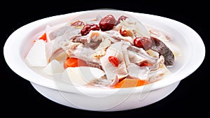 Pork bellies, red jujube, papaya, HuaiShan soup, Chinese traditional cuisine isolated on black background