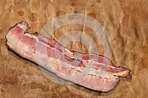 Pork Belly Bacon Rasher Set On Old Weathered Wizened Stained Cowhide Surface