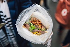 Pork Belly Bun Gua Bao: Steaming white bun with warm braised pork belly in street food market at Yuchi Township, Nantou County.