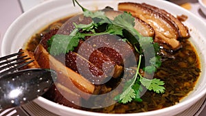 Pork Belly with preserved Mustard vegetables and dark soy sauce.