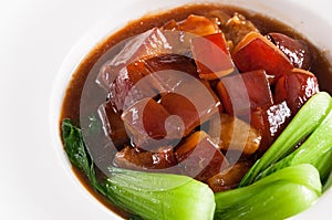 Pork braised in brown sauce with vegetables photo