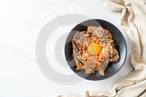 Pork bulgogi rice bowl with kimchi and Korean pickled egg