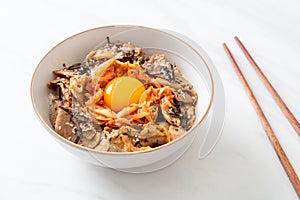 Pork bulgogi rice bowl with kimchi and Korean pickled egg