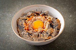 Pork bulgogi rice bowl with kimchi and Korean pickled egg