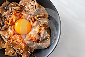 Pork bulgogi rice bowl with kimchi and Korean pickled egg