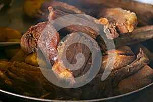 Pork chicharrÃ³n is a traditional food in Peru. photo