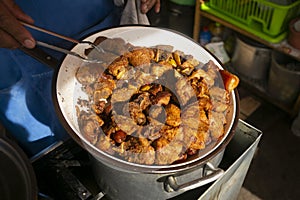 Pork chicharrÃ³n is a traditional food in Peru. photo